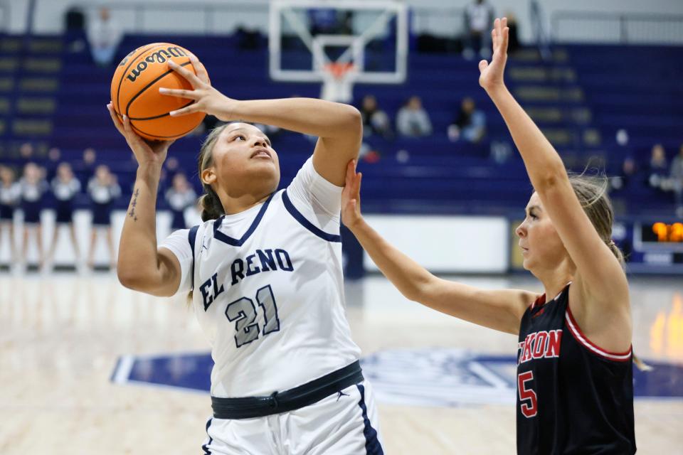 El Reno's Pauline Black-Harmon puts up a shot as Yukon's Kalli Harbeson defends during the Shawnee Invitational basketball tournament championship game between El Reno and Yukon in Shawnee, Okla., Saturday, Jan. 20, 2024.