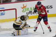 Boston Bruins goaltender Linus Ullmark (35) stops a shot on goal by Florida Panthers center Sam Bennett (9) during the third period of Game 4 of an NHL hockey Stanley Cup first-round playoff series, Sunday, April 23, 2023, in Sunrise, Fla. (AP Photo/Marta Lavandier)