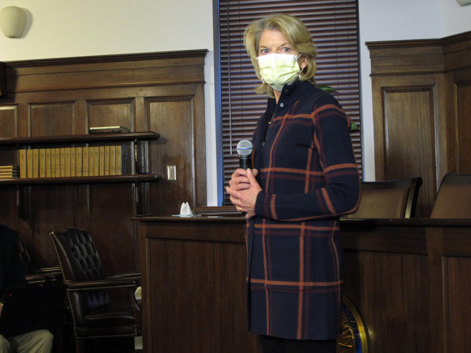 Alaska Republican U.S. Sen. Lisa Murkowski speaks to reporters during a visit to the state Capitol on Tuesday, Feb. 16, 2021, in Juneau, Alaska. Murkowski said she knows there could be political consequences for her vote to convict former President Donald Trump during his recent impeachment trial but says she can't be afraid of that. (AP Photo/Becky Bohrer)