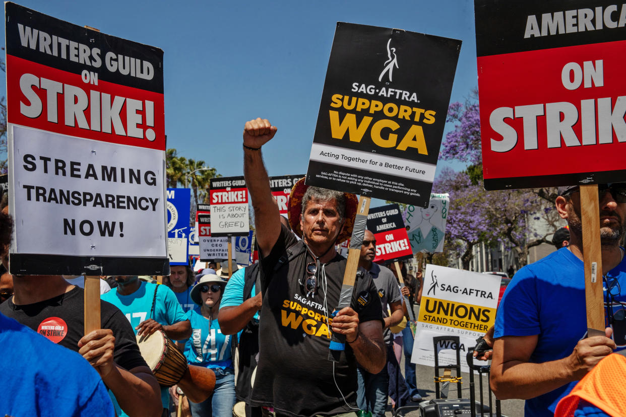 Members of SAG-AFTRA join striking members of the Writers Guild of America in Los Angeles on June 21, 2023.  (Irfan Khan / Los Angeles Times via Getty Images)