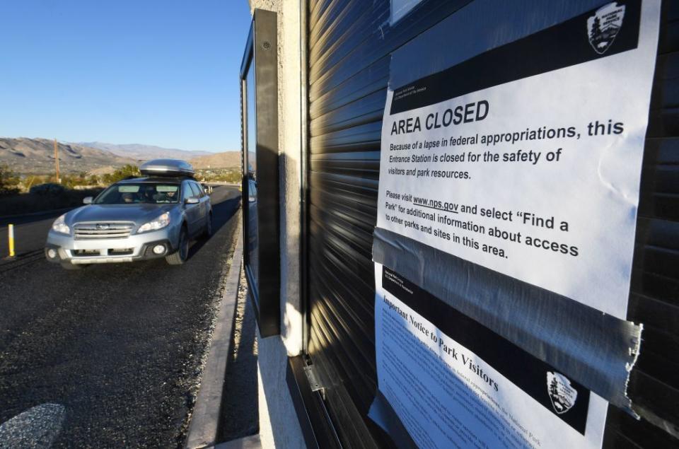 Tourists drive past signs placed by staff at the entrance gate to the Joshua Tree National Park after the federal government’s partial shutdown caused park rangers to stay home and campgrounds to be shut, at the park in California on January 3, 2019. US President Donald Trump warned the US federal government may not fully reopen any time soon, as he stood firm on his demand for billions of dollars in funding for a border wall with Mexico. (Photo from Mark Ralston/AFP)