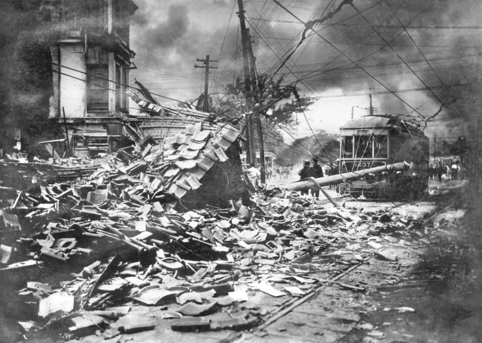 Smoke rises over the damaged buildings after an earthquake in Tokyo on Sept. 1, 1923. On Friday, Sept. 1, 2023, Japan marked the centennial of the 1923 Great Kanto Quake that killed more than 100,000. (Kyodo News via AP)