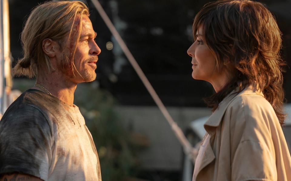 Brad Pitt and Sandra Bullock, who makes one of the film's star cameos - SONY PICTURES