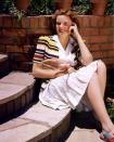 <p>Judy Garland looks ready for a match up, as she poses with a badminton racket in her backyard in 1945.</p>