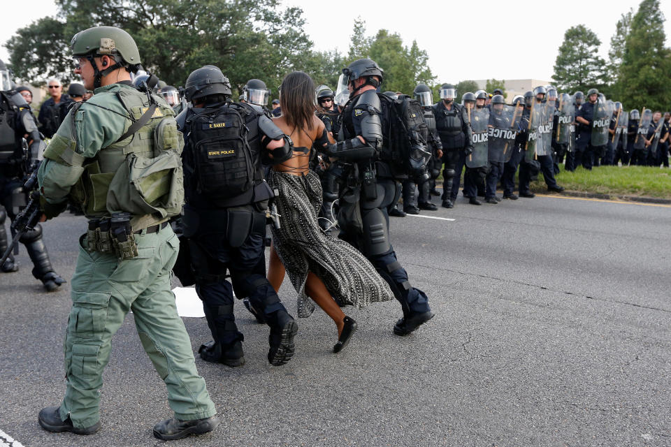 Protestor Ieshia Evans is detained by law enforcement near the headquarters of the Baton Rouge Police Department in Baton Rouge, Louisiana, U.S. July 9, 2016.  REUTERS/Jonathan Bachman          SEARCH "#BLACK LIVES MATTER" FOR THIS STORY. SEARCH "THE WIDER IMAGE" FOR ALL STORIES. 