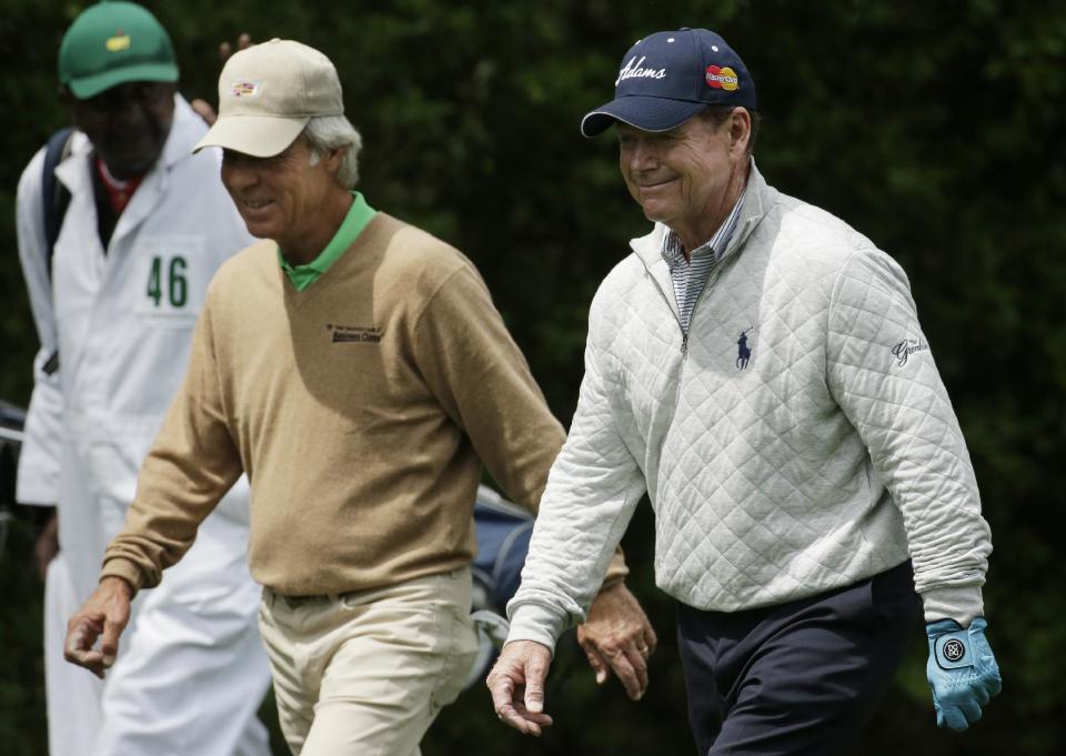 Ben Crenshaw, left and Tom Watson walk up the fifth fairway during a practice round for the Masters golf tournament Tuesday, April 8, 2014, in Augusta, Ga. (AP Photo/Chris Carlson)