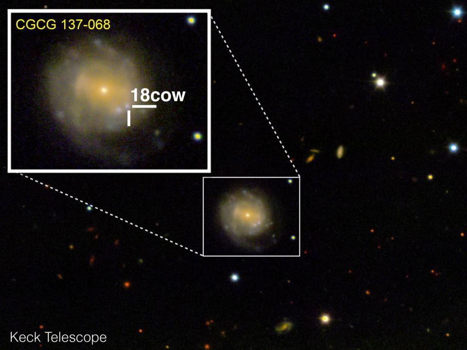 A satellite image of a yellow galaxy, zoomed in on a bright blue dot of light representing a rare space explosion called a fast blue optical transient