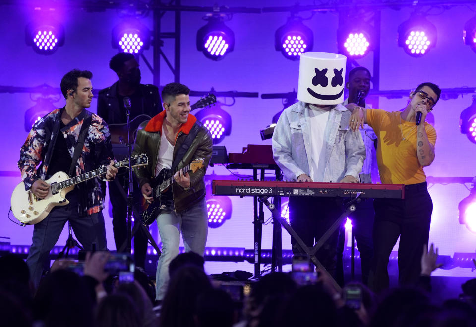 Kevin Jonas, Nick Jonas, DJ Marshmello and Joe Jonas perform at the Billboard Music Awards on Sunday, May 23, 2021, at the Microsoft Theater in Los Angeles. (AP Photo/Chris Pizzello)