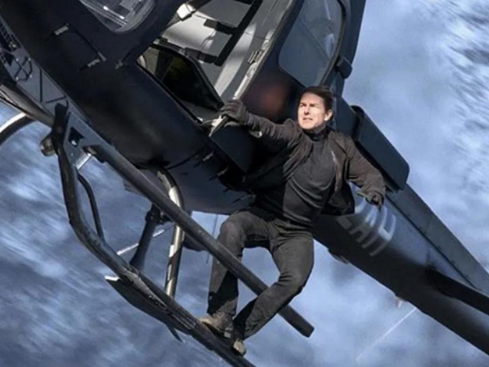 Tom Cruise holding onto a helicopter in "Mission: Impossible - Fallout."