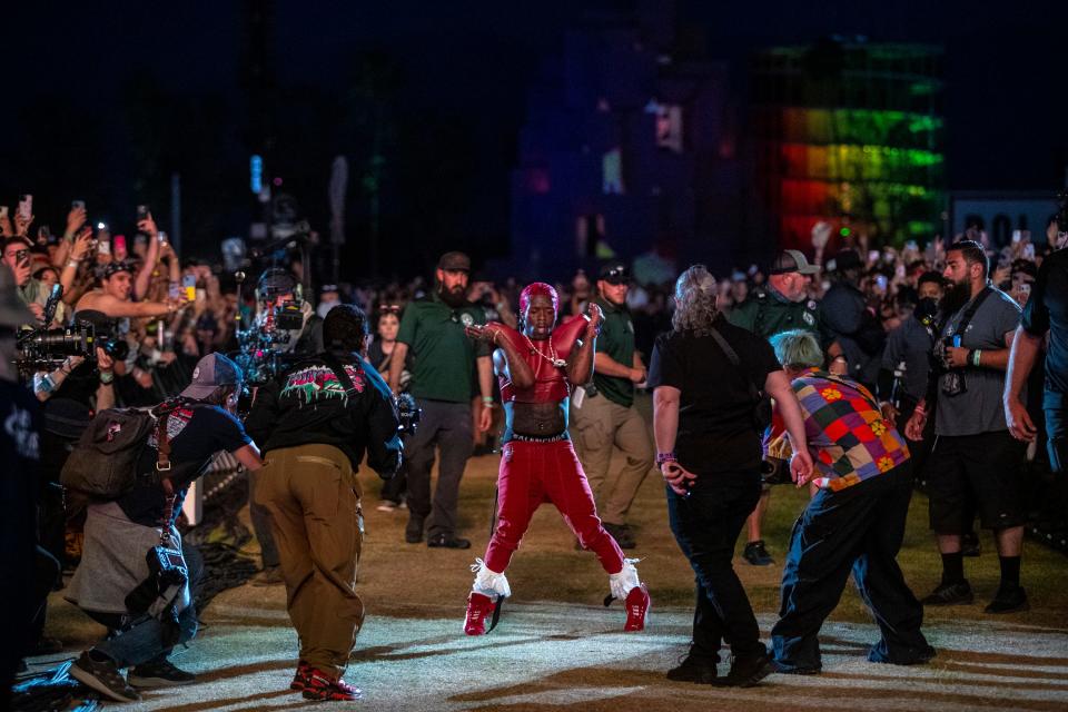 Lil Uzi Vert performs on the grass between sections of the crowd at the Coachella Stage during the Coachella Valley Music and Arts Festival in Indio, Calif., Friday, April 19, 2024.