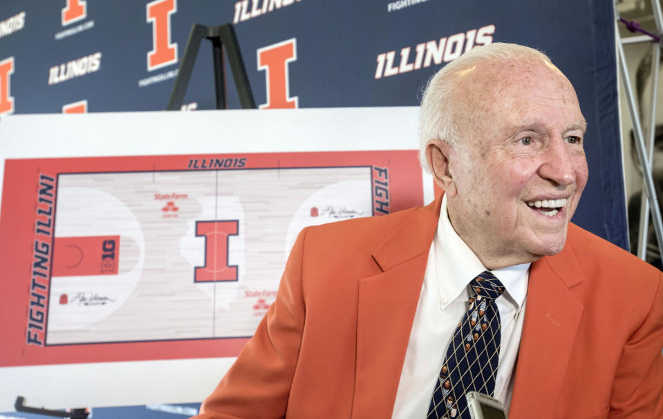 FILE - In this Aug. 24, 2015, file photo, former Illinois men's basketball coach Lou Henson is interviewed during a ceremony announcing the naming of the basketball court at State Farm Center to "Lou Henson Court" at Memorial Stadium's 77 Club in Champaign, Ill. Henson, the basketball coach who led Illinois back into the national spotlight, has died at age 88. The school said Henson died Saturday, July, 25, 2020, and was buried on Wednesday, July 29, 2020. (Rick Danz/The News-Gazette via AP, File)