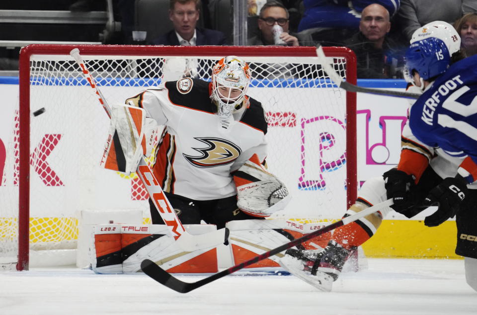 Toronto Maple Leafs' Alexander Kerfoot (15) scores on Anaheim Ducks goaltender Lukas Dostal (1) during the third period of an NHL hockey game in Toronto on Tuesday, Dec. 13, 2022. (Frank Gunn/The Canadian Press via AP)