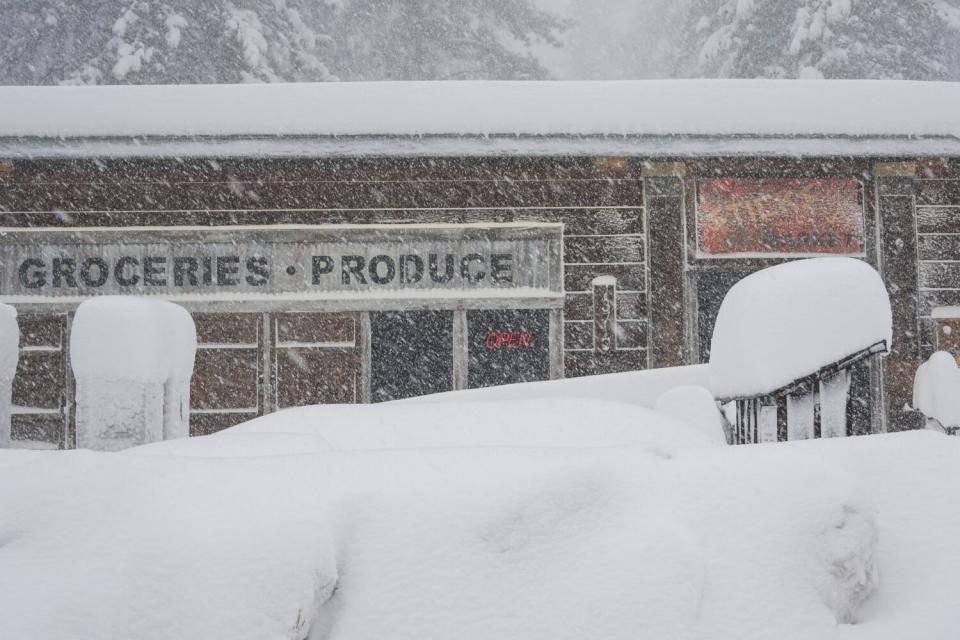 Snow covers the landscape in front of a store in Truckee on Saturday.