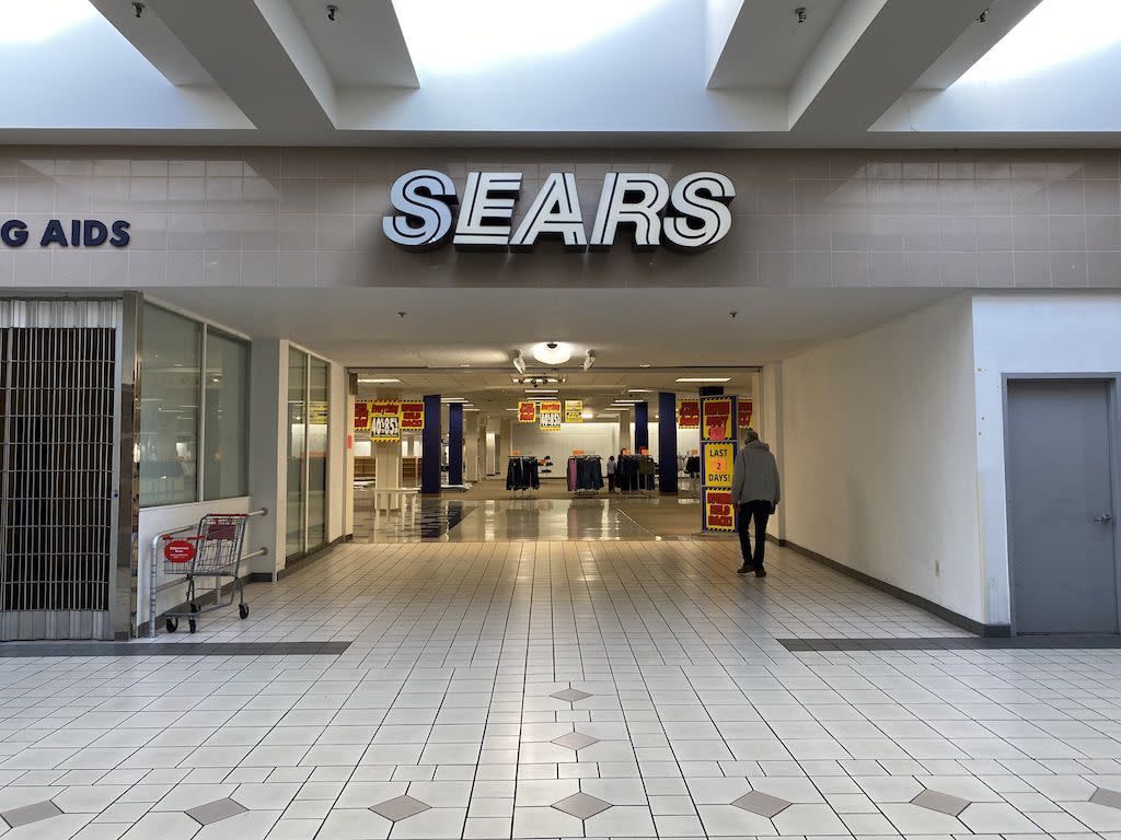 One man walking into Harrisburg Sears