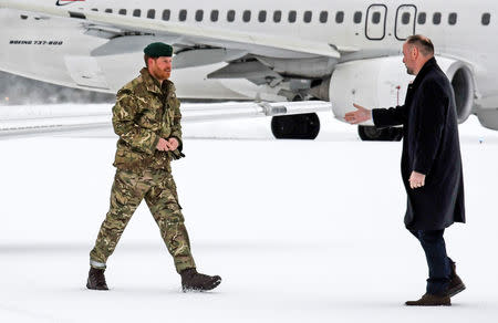 Britain's Prince Harry, Duke of Sussex is welcomed by the ambassador of Britain in Norway, Richard Wood in Bardufoss, Norway February 14, 2019. NTB Scanpix/ Rune Stoltz Bertinussen via REUTERS