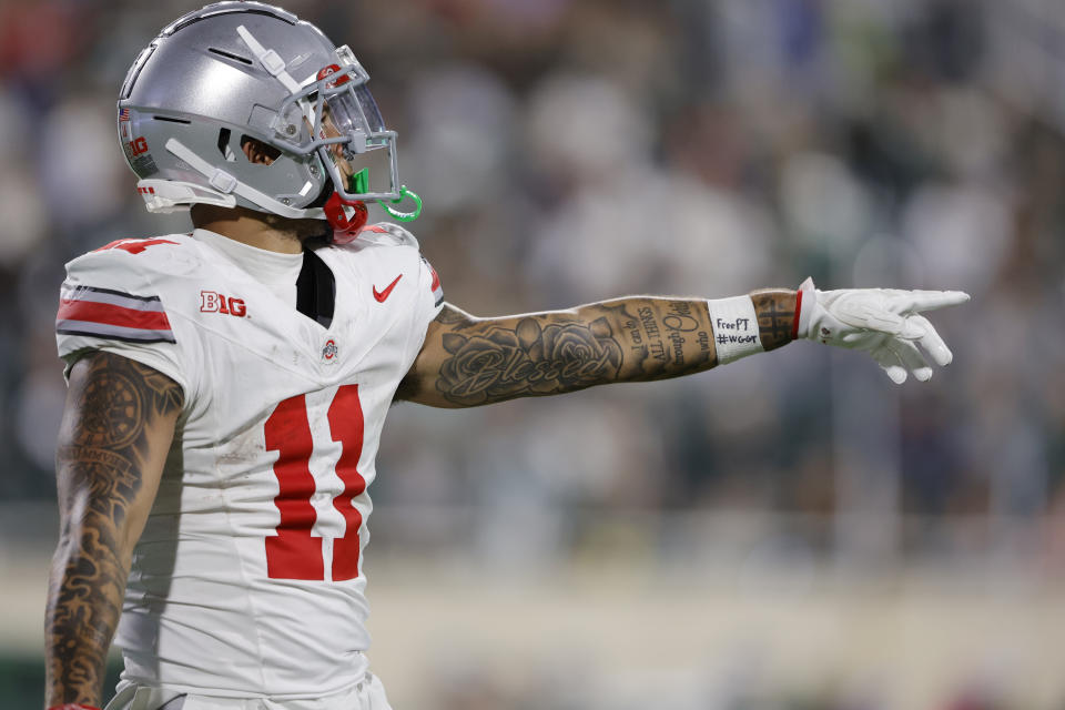 EAST LANSING, MICHIGAN - SEPTEMBER 28: Brandon Inniss #11 of the Ohio State Buckeyes reacts to a call during the second half of the game against the Michigan State Spartans at Spartan Stadium on September 28, 2024 in East Lansing, Michigan. (Photo by Rey Del Rio/Getty Images)