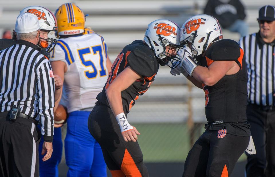 Washington's Elijah Papis, left, and Elijah Baer celebrate Papis' sack against Crete-Monee in the second half of their Class 6A second-round playoff game Saturday, Nov. 4, 2023 in Washington. The Panthers advanced with a 21-0 win.