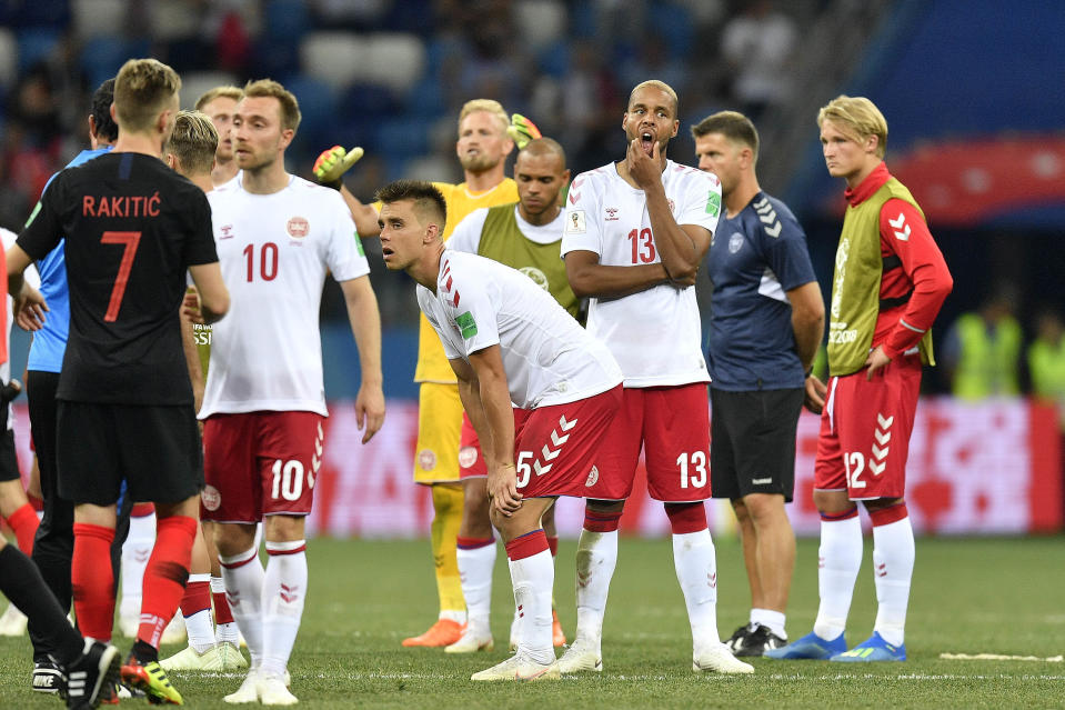 <p>Denmark players react after missing out on their attempt to reach the quarter finals </p>