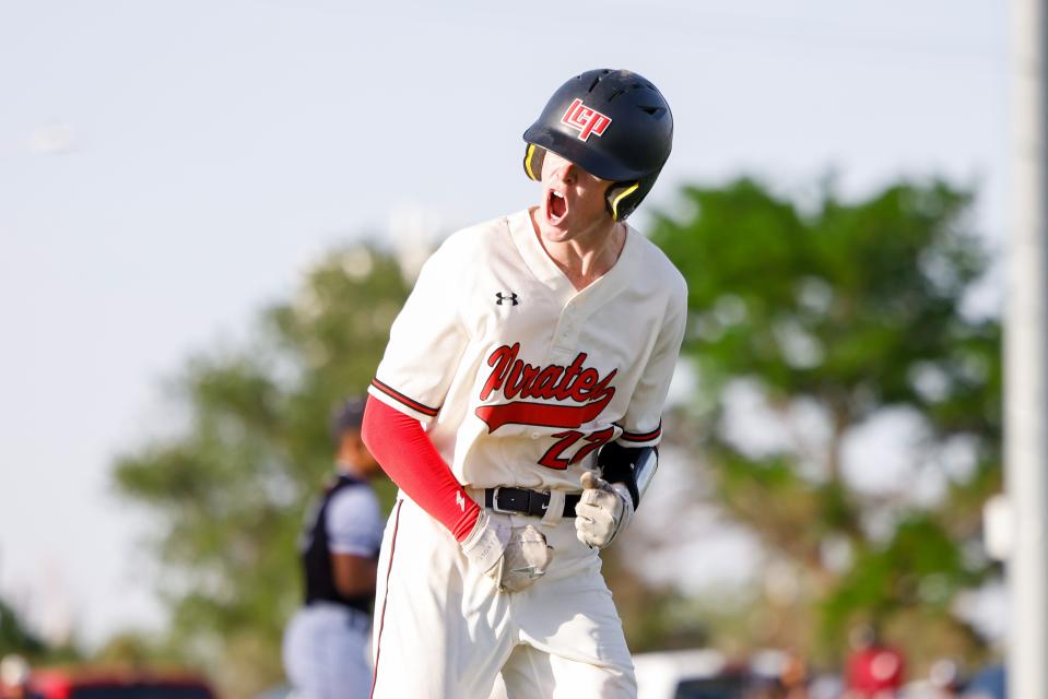 Lubbock-Cooper’s Kylar Galmor (27) celebrates while running to first during the Region 1-5A Quarterfinals series game against Randall on Friday, May 20, 2022, in Plainview, Texas.