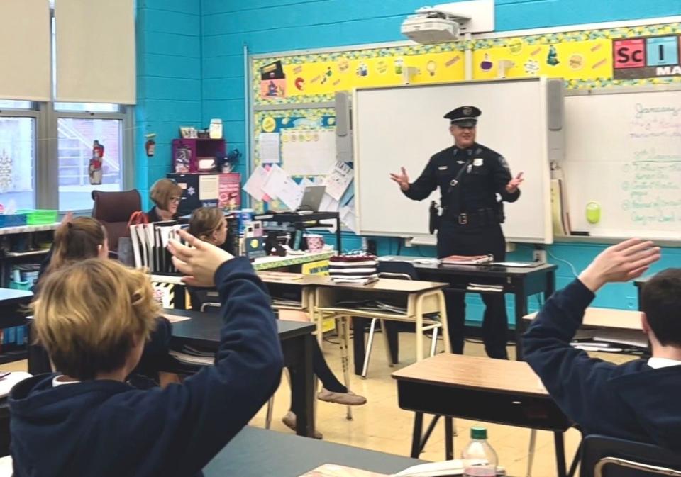 Stanislao, also a juvenile officer, teaches L.E.A.D. to a fifth-grade class at Academy of Our Lady on Rodney Street on Jan. 5.