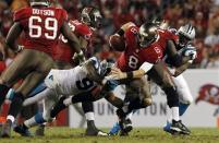 Oct 24, 2013; Tampa, FL, USA; Carolina Panthers defensive end Charles Johnson (95) sacks Tampa Bay Buccaneers quarterback Mike Glennon (8) during the second half at Raymond James Stadium. Kim Klement-USA TODAY Sports