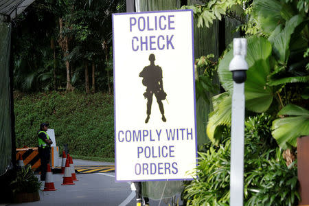 REFILE - CORRECTING DATE A policewoman stands guard at an entrance to Capella Hotel on Sentosa Island in Singapore June 11, 2018. REUTERS/Kim Kyung-Hoon