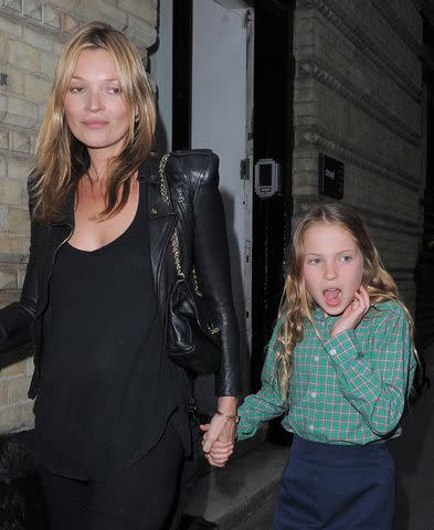 <p>Will/GC Images</p> Kate Moss and daughter Lila attend a photo exhibition in London in 2013.