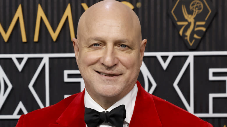 Tom Colicchio in red suit bow with tie