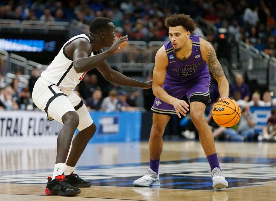 Furman Paladins forward Jalen Slawson (20) is defended by San Diego State Aztecs forward Aguek Arop (33) during the first half in the second round of the 2023 NCAA Tournament on March 18, 2023, at Legacy Arena in Orlando, Florida.