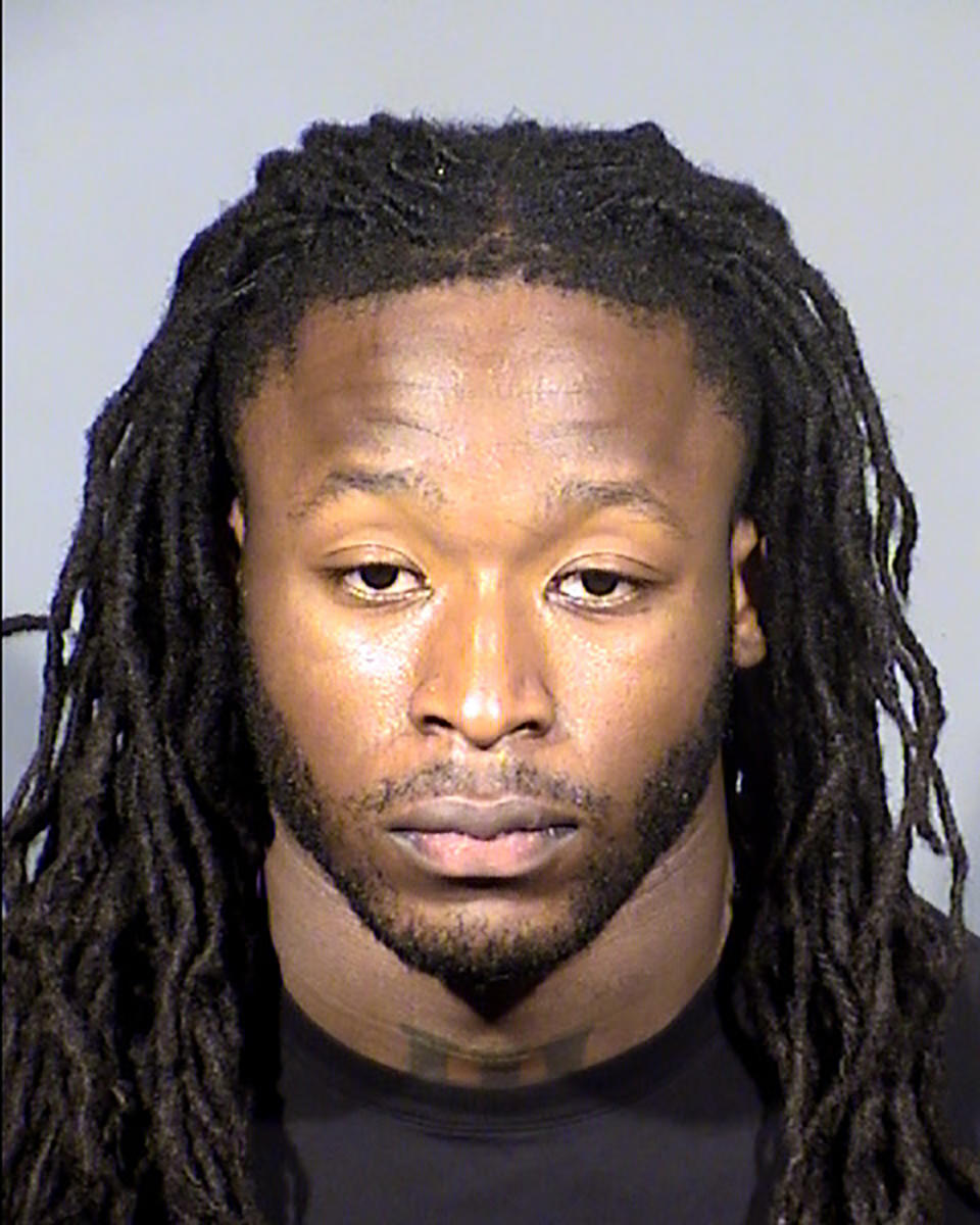 This Clark County Detention Center booking photo shows New Orleans Saints running back Alvin Kamara following his arrest Sunday, Feb. 6, 2022, in Las Vegas on a felony battery charge. Kamara is accused of punching a man multiple times and badly injuring him about 6:30 a.m. Saturday, Feb. 5, 2022, at a Las Vegas Strip nightclub. Kamara, 26, was arrested after playing in the NFL Pro Bowl and later released on bond with a March 8 court date. (Clark County Detention via AP)