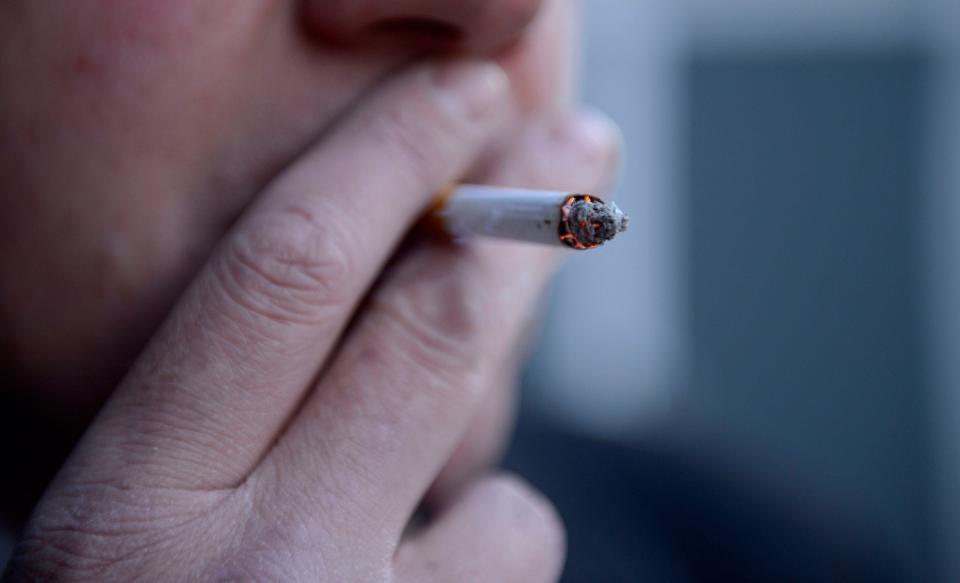 <p>File photo dated 12/03/13 of a man smoking a cigarette.</p> (PA)