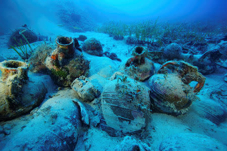 Amphorae are seen at the sea bottom at a shipwreck site on the island of Fournoi, Greece, September 15, 2018. Picture taken September 15, 2018. Vassilis Mentogiannis/Hellenic Ephorate of Underwater Antiquities/Handout via REUTERS ATTENTION EDITORS - THIS PICTURE WAS PROVIDED BY A THIRD PARTY.