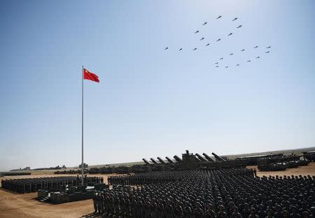 Soldiers of China's People's Liberation Army (PLA) take part in a military parade to commemorate the 90th anniversary of the foundation of the army at the Zhurihe military training base in Inner Mongolia Autonomous Region, China July 30, 2017. Xinhua via REUTERS