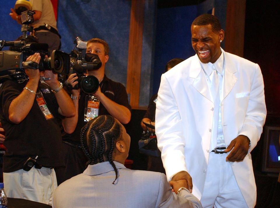 St. Vincent-St. Mary graduate LeBron James shares a laugh with friend Carmelo Anthony as they await the start of the NBA Draft at Madison Square Garden in New York on June 26, 2003.