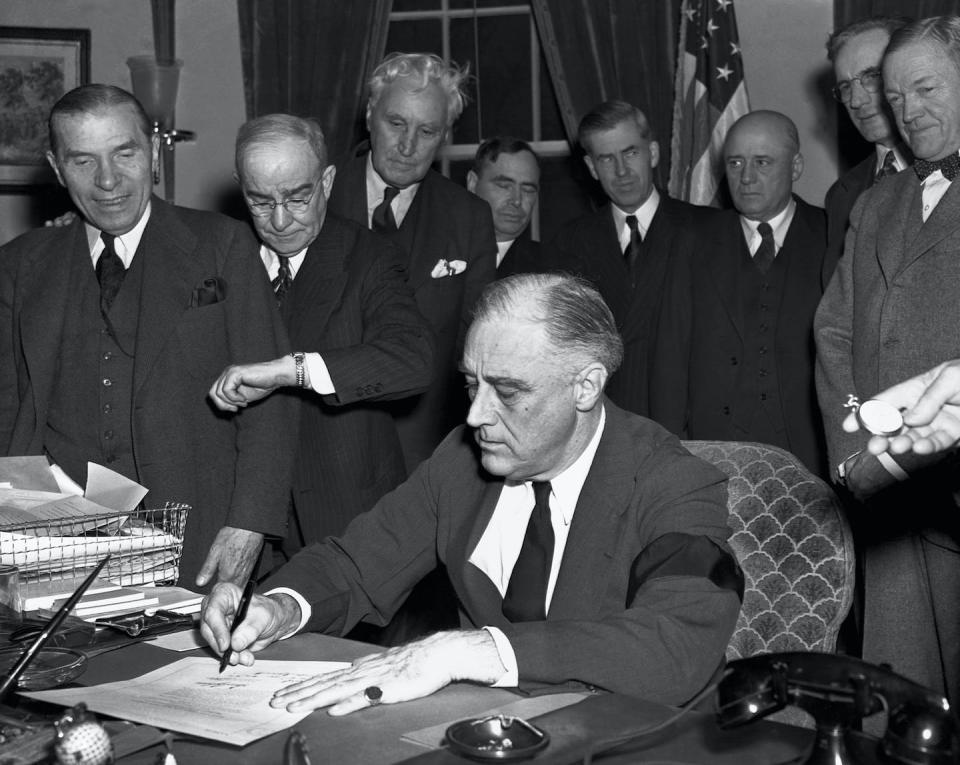 On Dec. 8, 1941, a day after the attack on Pearl Harbor, President Franklin D. Roosevelt signed the U.S. declaration of war against Japan. <a href="https://www.gettyimages.com/detail/news-photo/cabinet-members-watch-with-mixed-emotions-as-president-news-photo/514080362?adppopup=true" rel="nofollow noopener" target="_blank" data-ylk="slk:Bettmann/GettyImages;elm:context_link;itc:0;sec:content-canvas" class="link ">Bettmann/GettyImages</a>