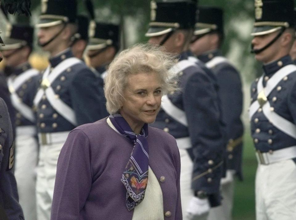 U.S. Supreme Court Justice Sandra Day O'Connor walks past an honor guard on the way to address The Citadel Corps of Cadets on April 4, 2000, at the military college in Charleston, S.C.