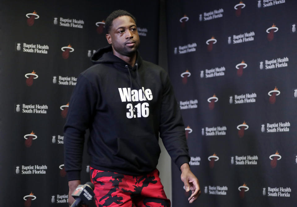 Miami Heat guard Dwyane Wade arrives for a news conference during media day at the NBA basketball team's practice facility, Monday, Sept. 24, 2018, in Miami. This will be Wade's 16th and final season in the NBA. (AP Photo/Lynne Sladky)