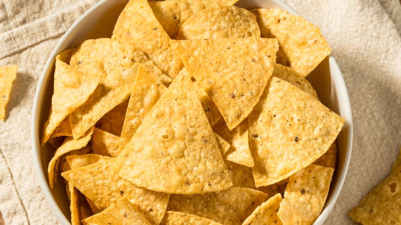 homemade triangle tortilla chips in a bowl