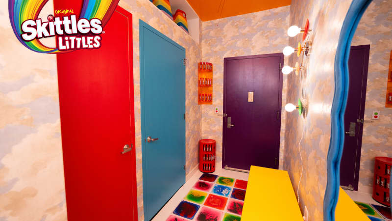 Colorful hallway at entry of Skittles Littles apartment, designed by Dani Klaric.