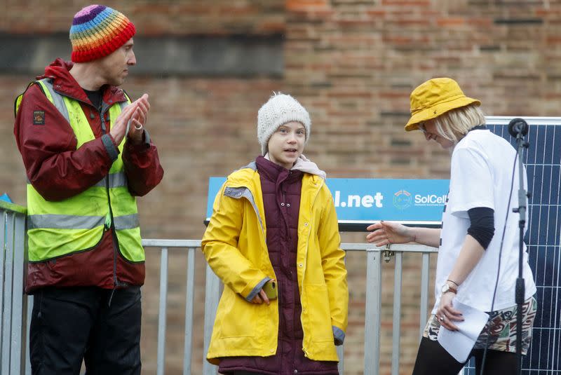 Swedish environmental activist Greta Thunberg arrives on a stage during a youth climate protest in Bristol