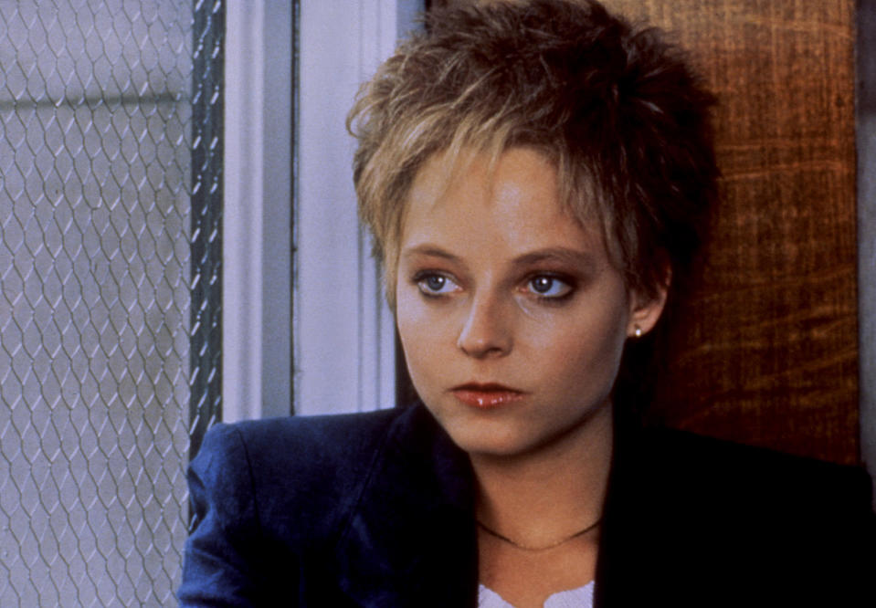 Jodie Foster in a scene from the movie "The Accused," wearing a jacket and looking pensive