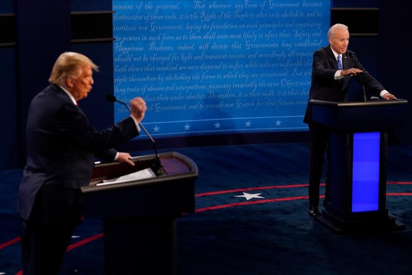 NASHVILLE, TENNESSEE - OCTOBER 22: Democratic presidential candidate former Vice President Joe Biden answers a question as President Donald Trump listens during the second and final presidential debate at Belmont University on October 22, 2020 in Nashville, Tennessee. This is the last debate between the two candidates before the election on November 3. (Photo by Morry Gash-Pool/Getty Images)