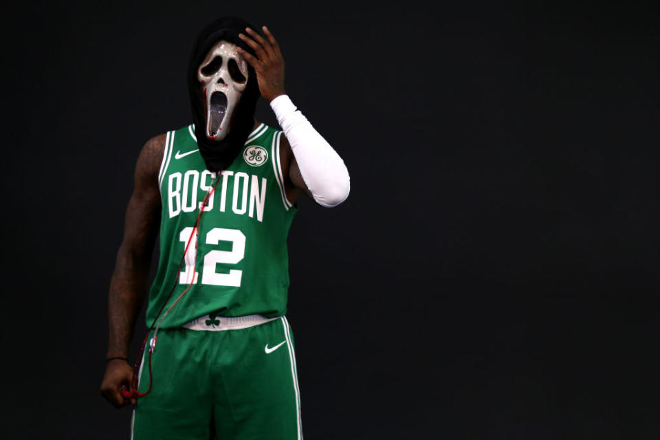 Boston Celtics guard Terry Rozier wears a Ghost Face mask during a media day photo session. (Getty Images)