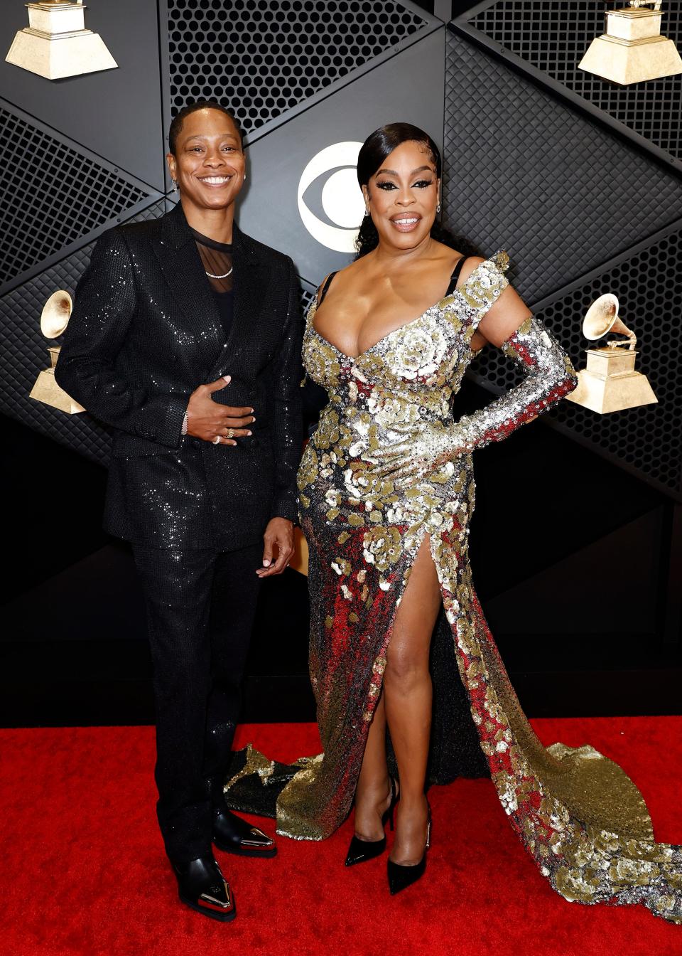 Jessica Betts and Niecy Nash attend the 2024 Grammys.