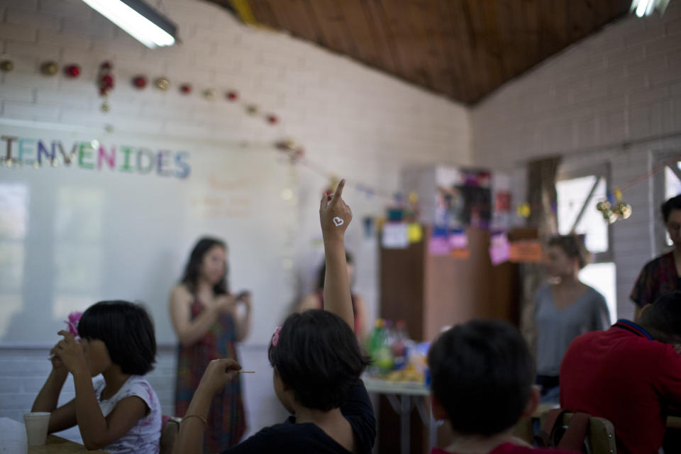 In this Dec.12, 2018 photo, transgender children participate in a class at the Amaranta Gomez school, in Santiago, Chile. Teachers work pro bono, but all other expenses for the school's first year were funded by Selenna Foundation President Evelyn Silva and school coordinator Ximena Maturana out of their personal savings. Starting in March, families will have to pay about $7 a month for each child. (AP Photo/Esteban Felix)