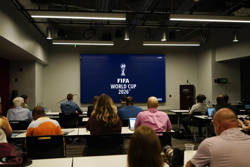 People wait and watch before FIFA announces a 2026 World Cup host cities on Thursday, June 16, 2022, in Atlanta. (AP Photo/Brynn Anderson)