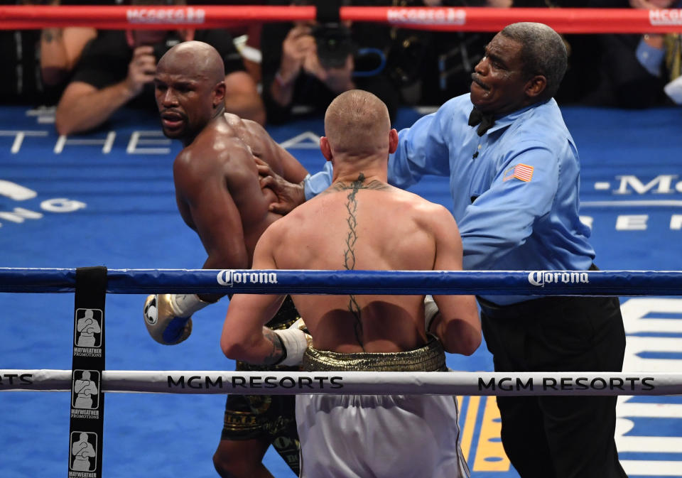 LAS VEGAS, NV - AUGUST 26:  Referee Robert Byrd stops the fight in round 10 with a TKO of Conor McGregor by Floyd Mayweather Jr. in their super welterweight boxing match on August 26, 2017 at T-Mobile Arena in Las Vegas, Nevada.  (Photo by Ethan Miller/Getty Images)