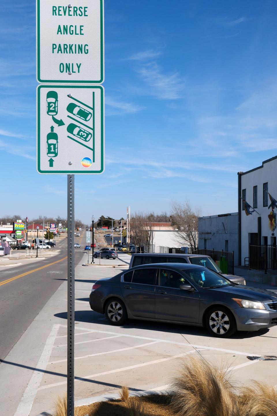 Cars are shown parked facing the curb earlier in the month, although signs in Oklahoma City's 39th Street District show that parking spots are intended for reverse-angle parking.