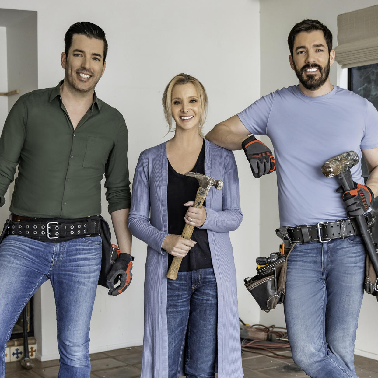 Lisa Kudrow, along with Drew and Jonathan Scott, demo the home of Lisa's cousin Thea Mann, as seen on Celebrity IOU. (HGTV)