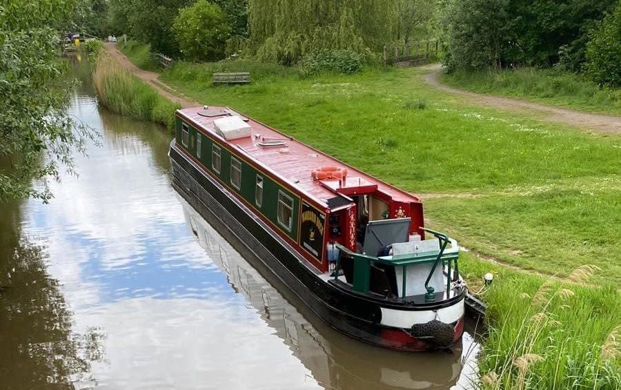 The sunken barge in happier times on the idyllic stretch of canal